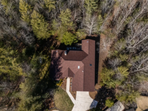 Aerial view of a Tennessee home with a fortified roof featuring reinforced shingles and sealed edges to withstand high winds and storms