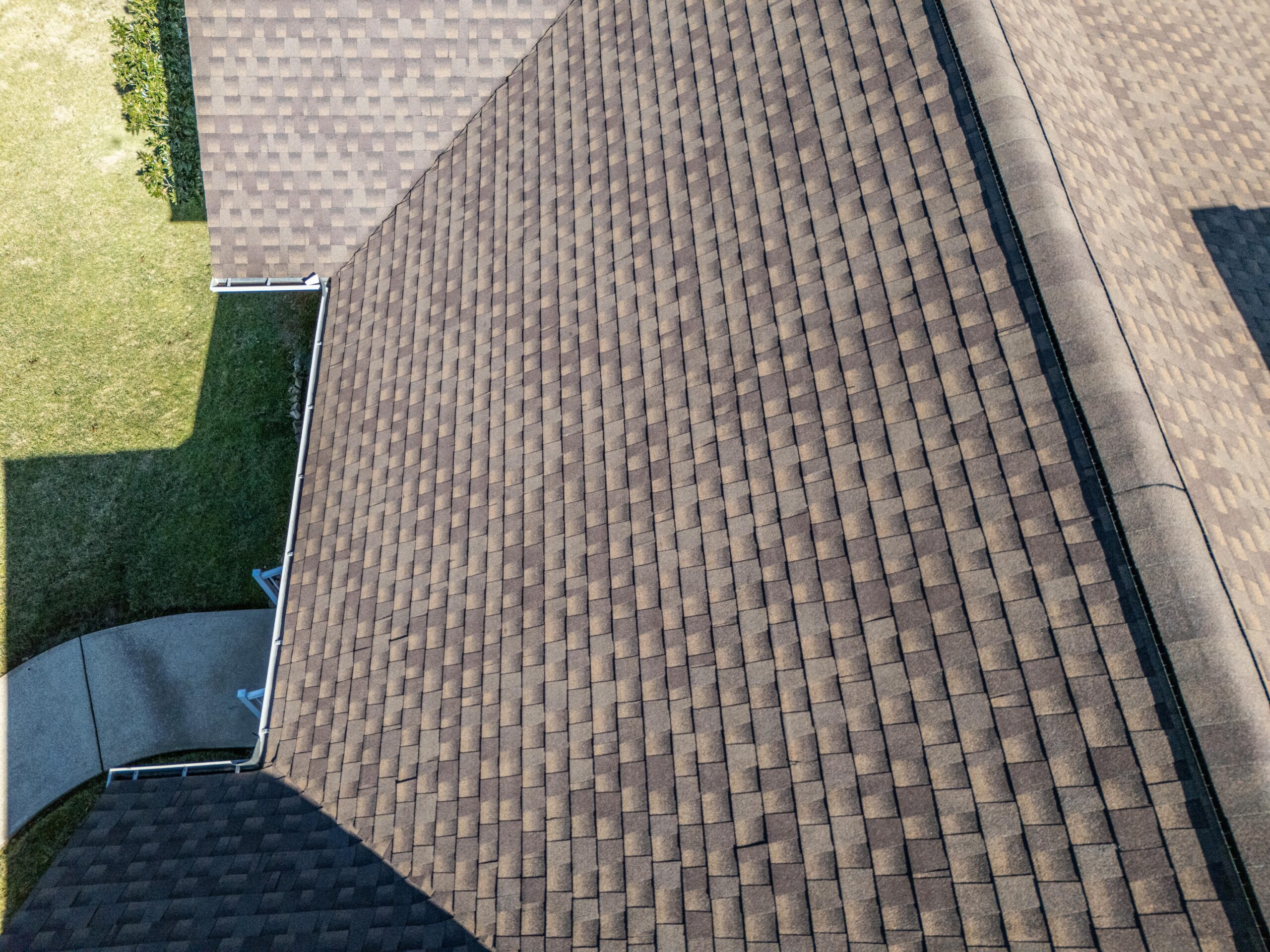 Aerial drone view of a completed asphalt shingle roof installation by Jeff Woods Construction in Tennessee